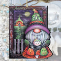 Hanging Halloween ornament with a BOO-hatted gnome, pumpkins, spiderwebs and Happy Halloween wording around a moonlit scene.