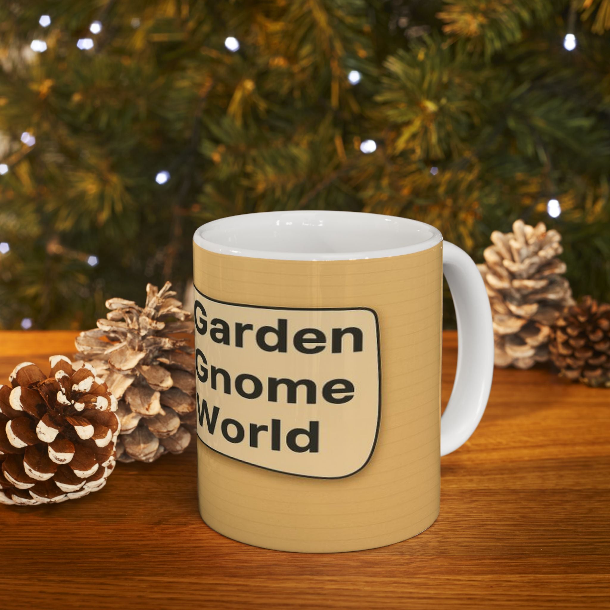 Beige mug with 'Garden Gnome World' text in front of a Christmas tree and pinecones.