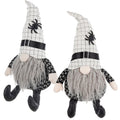 Two seated Halloween gnomes with white checked spider hats, gray beards, black buckles and patterned bodies.
