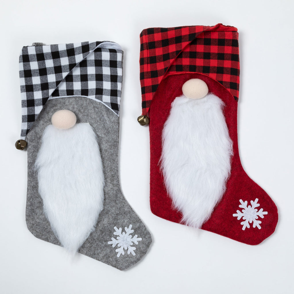 Gray and red Christmas stockings with white gnome beards, checked cuffs, small bells and snowflake accents.