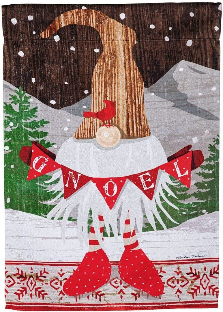 Christmas garden flag with a tall-hatted gnome holding a red GNOEL banner, a cardinal and snowy trees.