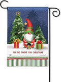 Garden flag with a red-and-green gnome, gifts and trees above the words I'll Be Gnome for Christmas.