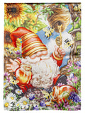 Garden flag with a striped-hat gnome, honey jar and dipper, surrounded by bees, flowers and a hanging beehive.
