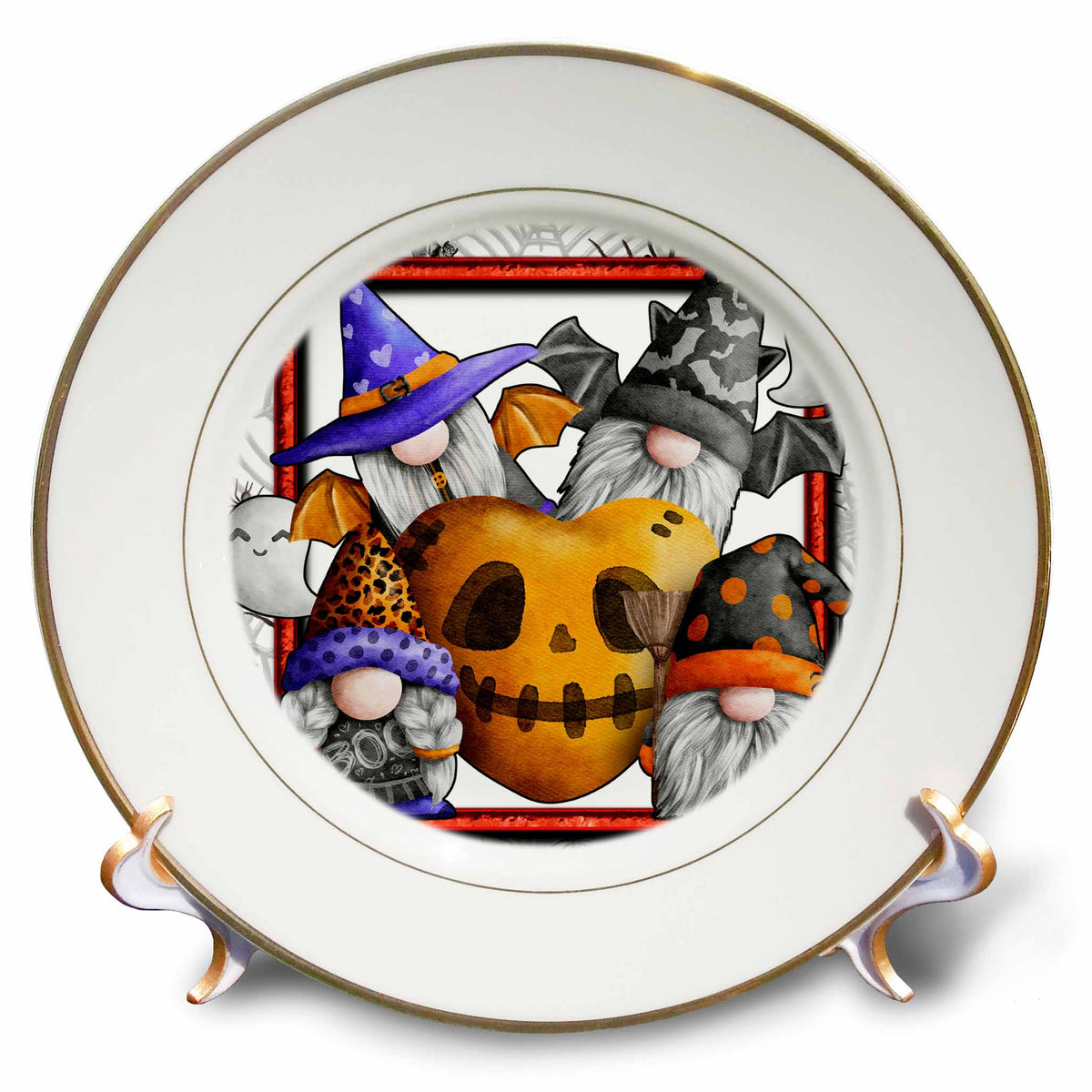 Gold-rimmed decorative plate showing four Halloween gnomes surrounding an orange skull-shaped heart.