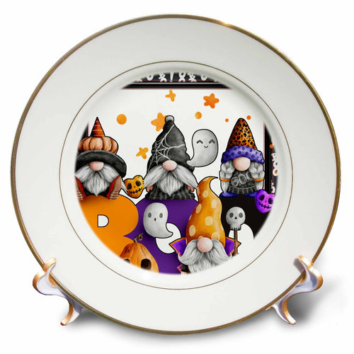 Gold-rimmed decorative plate showing Halloween gnomes with colorful hats, ghosts, skulls and large BOO lettering.