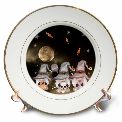 Gold-rimmed decorative plate depicting three witch-hatted gnomes with a pumpkin, skull and potion beneath a full moon.