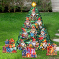 Christmas tree-shaped garden decoration with illustrated gnomes and a gold star, surrounded by gift-shaped stakes.