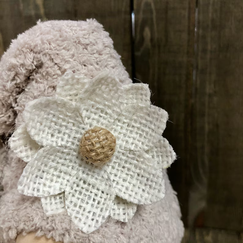 Floral accessory on a textured fabric background