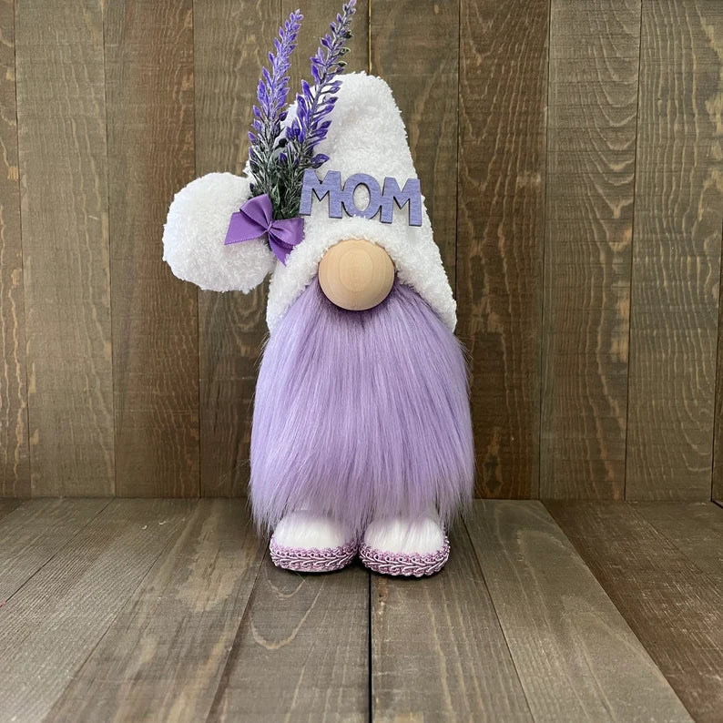 Decorative gnome with 'MOM' on a wooden background