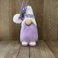Decorative gnome with 'MOM' on a wooden background