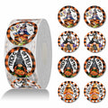 Roll of round orange-and-black Halloween gnome stickers with Boo, Trick or Treat and Sweet & Spooky designs.