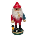Red wooden gnome incense smoker with a spotted hat, white beard, pipe, miniature tree and lantern.