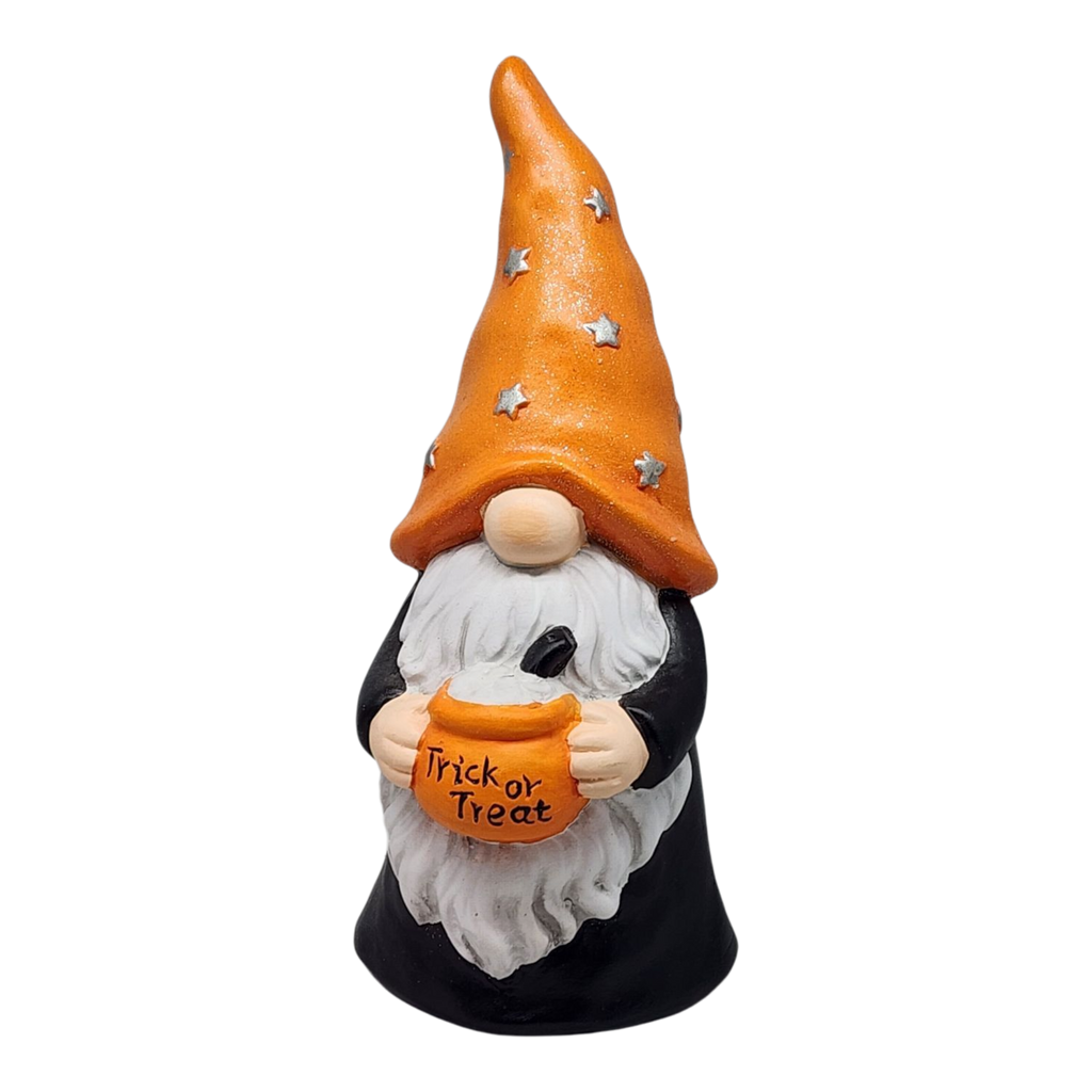 White-bearded gnome figurine wearing an orange star-decorated hat and holding a bucket labeled Trick or Treat.