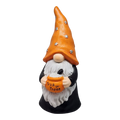 White-bearded gnome figurine wearing an orange star-decorated hat and holding a bucket labeled Trick or Treat.